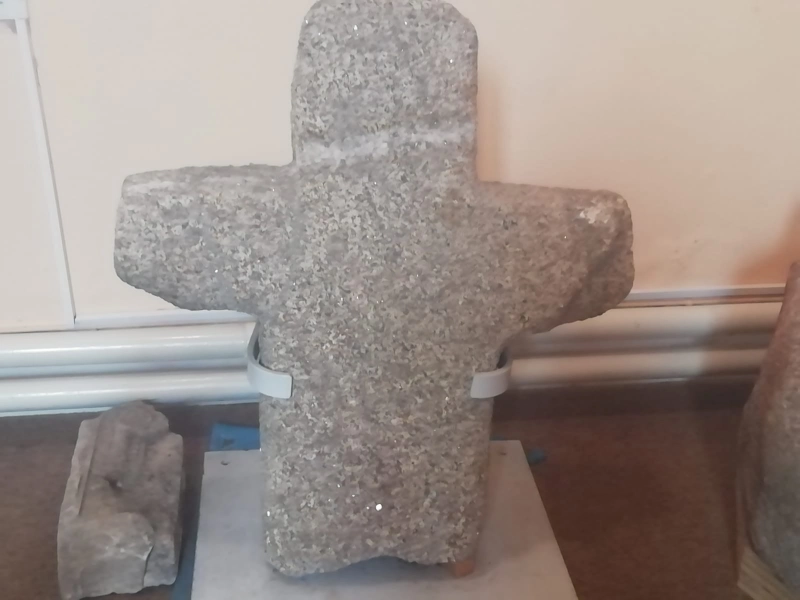 An ancient granite cross which stood originally outside the south wall of the nave.  It was repaired in 1995 and is similar to a cross located in Clondalkin, Co.Dublin.
